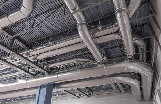 New sheet metal ductwork installed along a ceiling in a Dallas commercial building